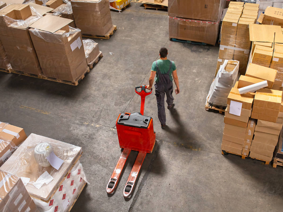 employee with empty hand truck